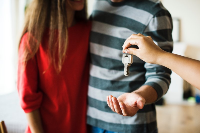 Couple being handed a set of keys